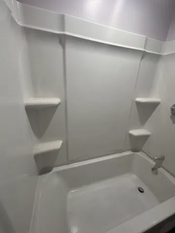 a bathroom with a bathtub