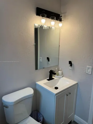 a view of a house with a flower garden