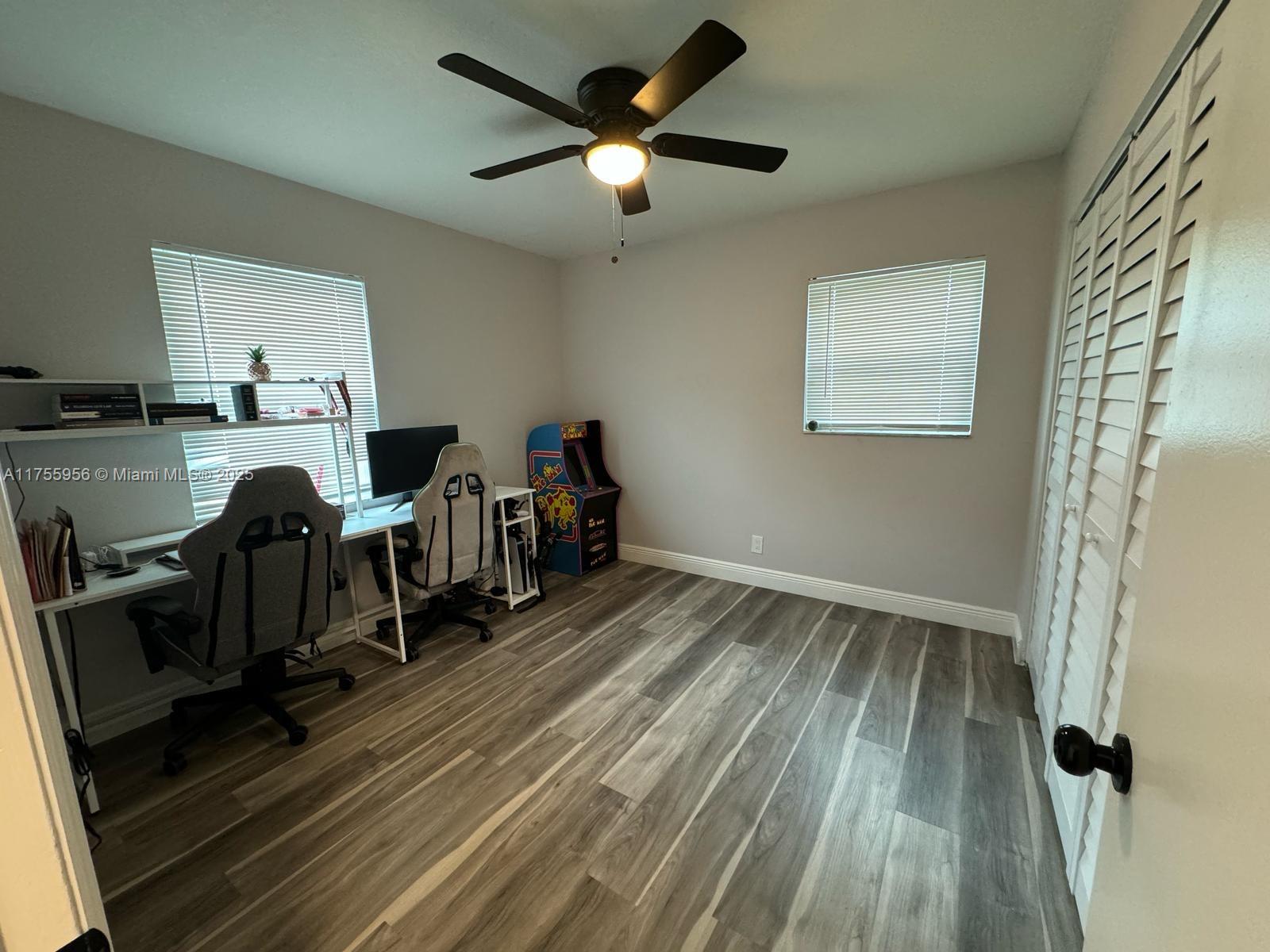 4161 Southwest 56th Avenue Davie, FL 33314 - Photo 20 of 40 a view of a workspace with furniture and wooden floor