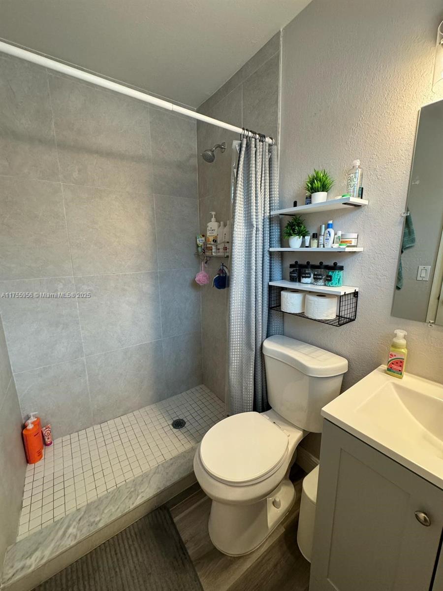4161 Southwest 56th Avenue Davie, FL 33314 - Photo 25 of 40 a bathroom with a toilet and shower