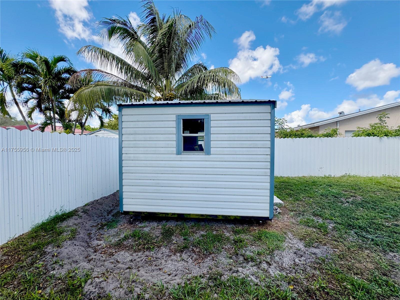 4161 Southwest 56th Avenue Davie, FL 33314 - Photo 33 of 40 a view of a house with a flower garden