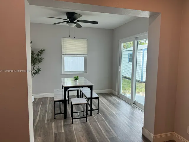 a kitchen with kitchen island stainless steel appliances a sink and counter space