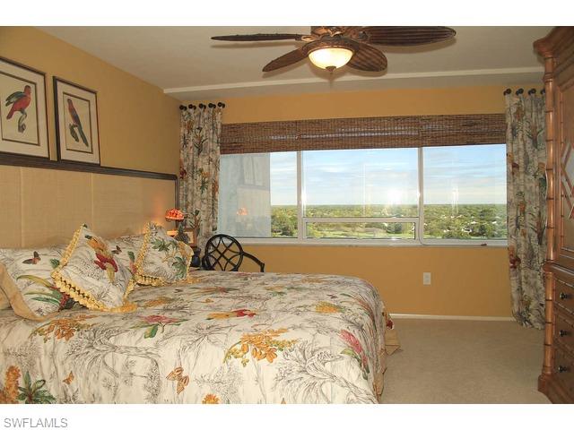 6825 Grenadier Boulevard Naples, FL 34108 - Photo 6 of 11 a view of a bedroom with a bed