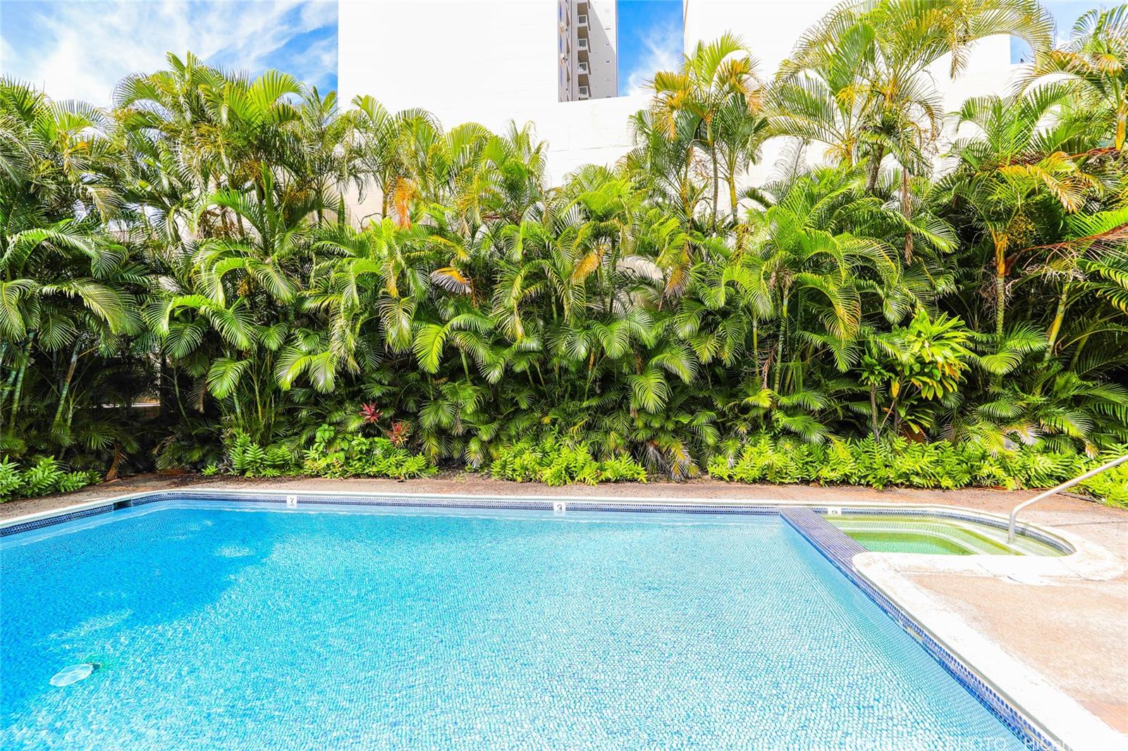 1114 Punahou Street, Unit 3B Honolulu, HI 96826 - Photo 19 of 25 a view of a garden with a bench
