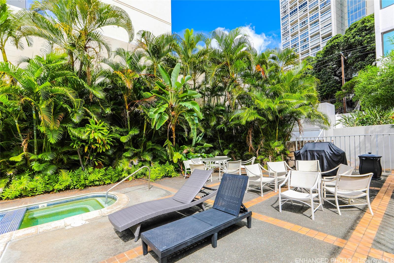 1114 Punahou Street, Unit 3B Honolulu, HI 96826 - Photo 20 of 25 a view of backyard with table and chairs and potted plants
