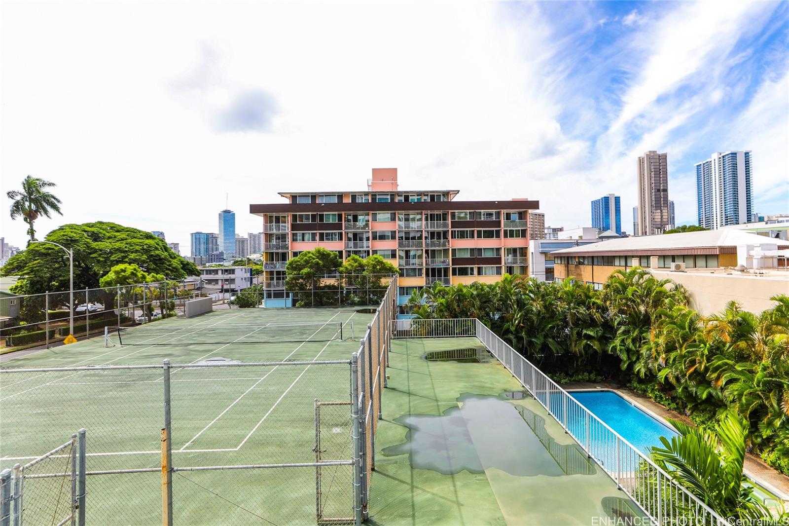 1114 Punahou Street, Unit 3B Honolulu, HI 96826 - Photo 22 of 25 a view of a swimming pool with a garden