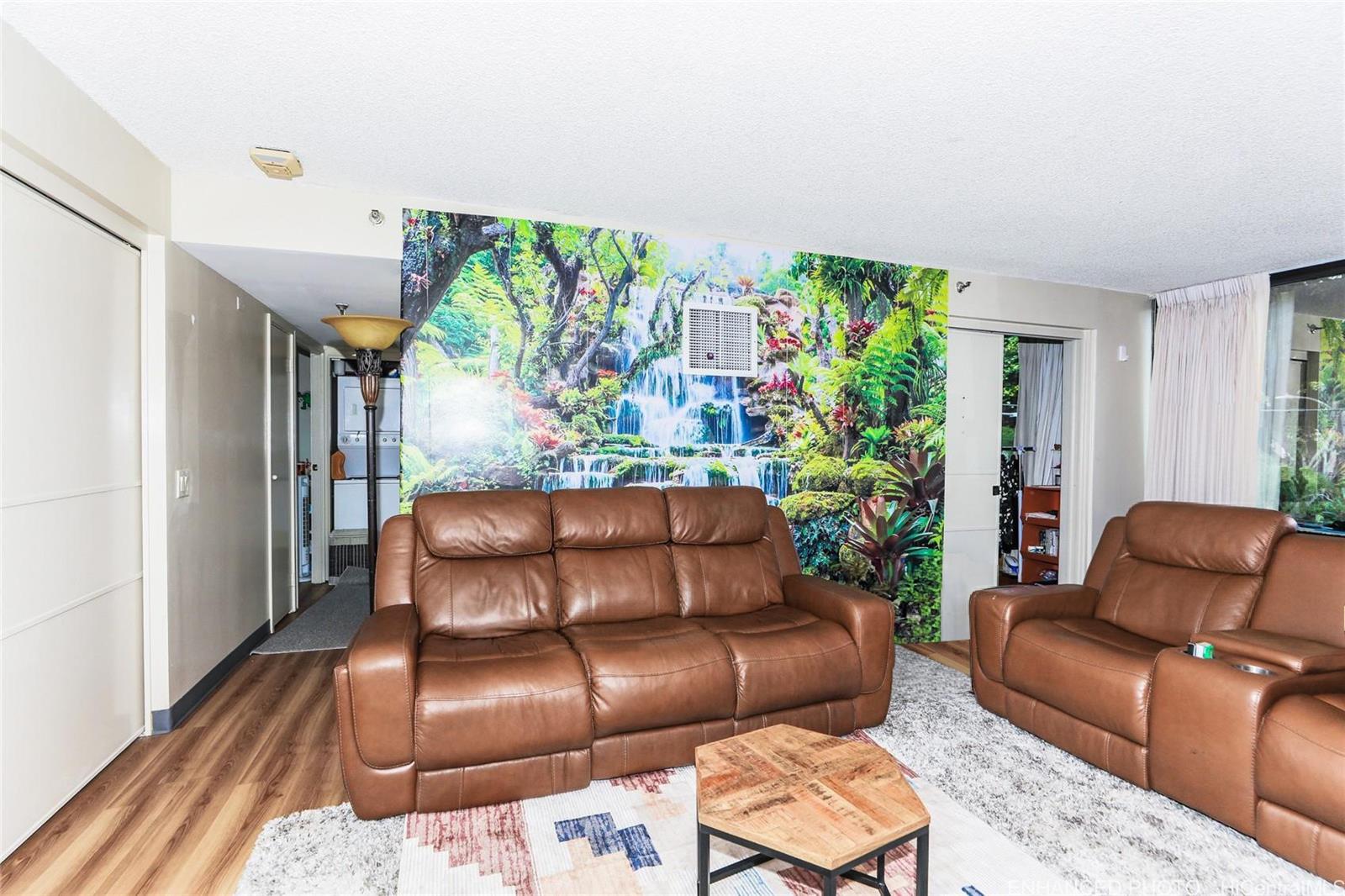 1114 Punahou Street, Unit 3B Honolulu, HI 96826 - Photo 3 of 25 a couch sitting in a living room with furniture and a potted plant