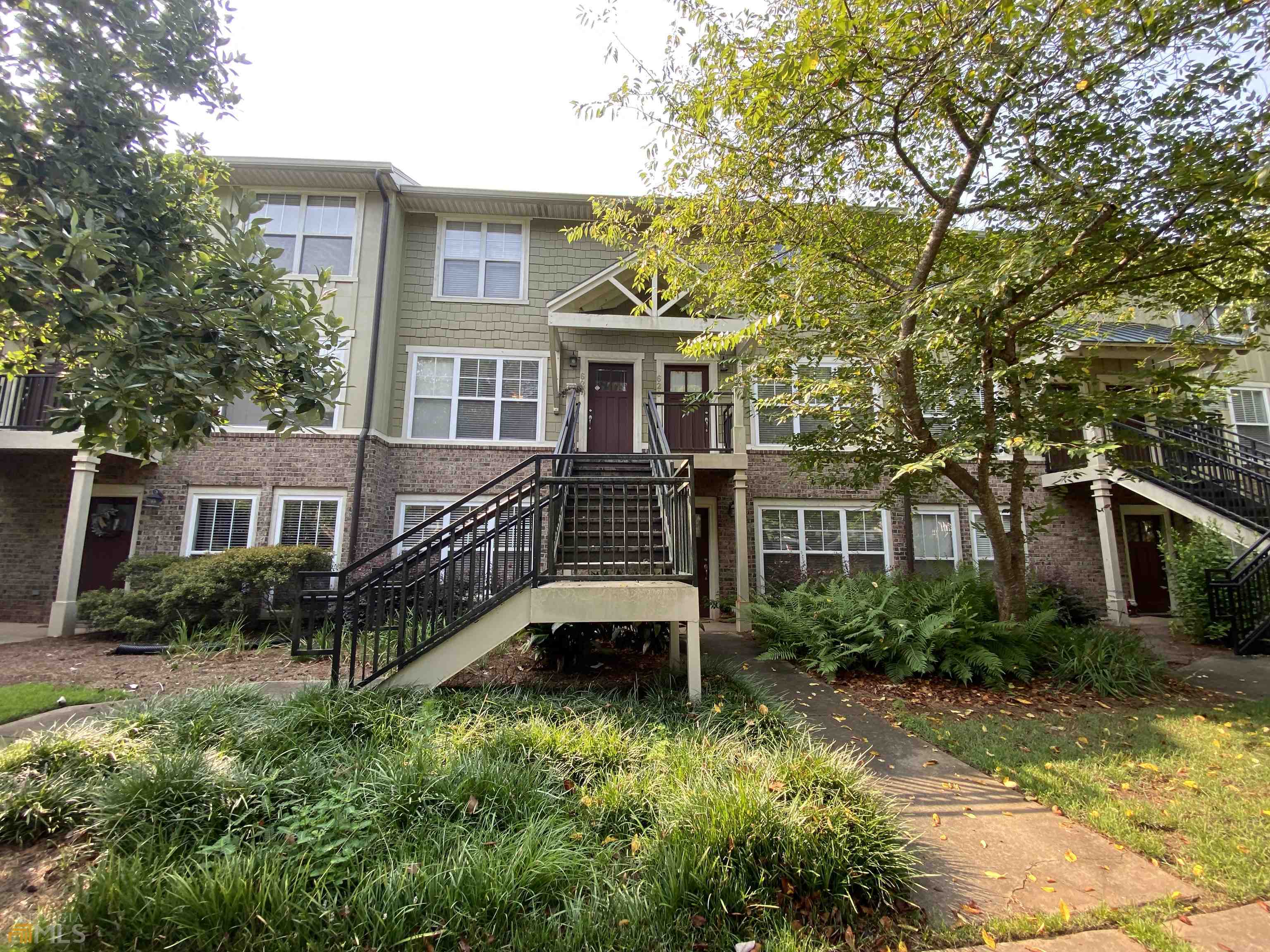 490 Barnett Shoals Road, Unit 628 Athens, GA 30605 - Photo 1 of 1 a front view of a house with yard and green space