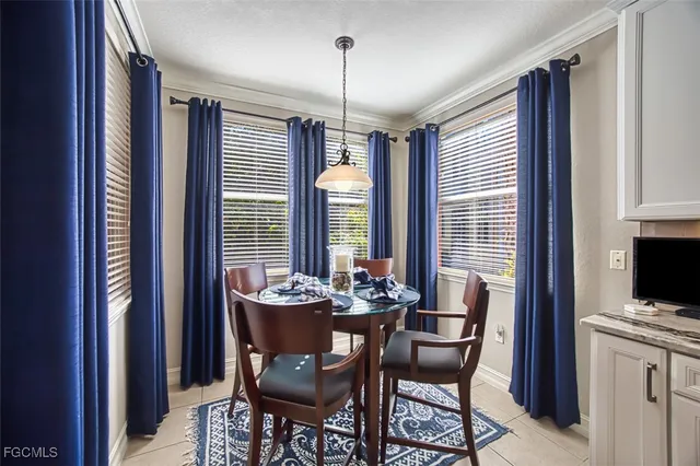 a dining room with furniture and window