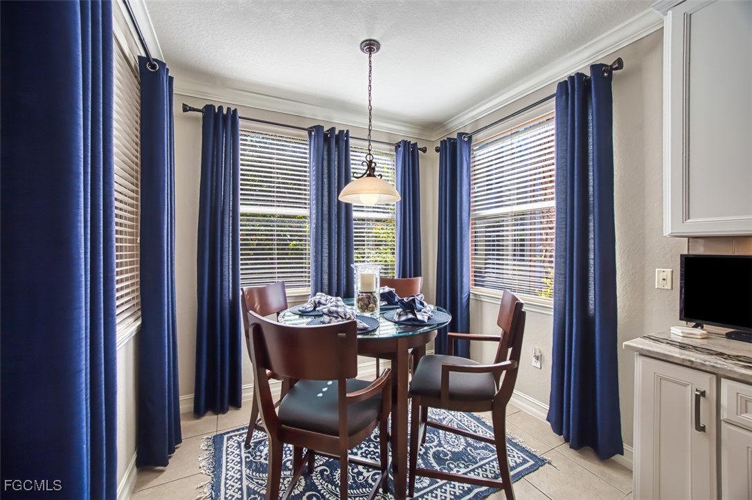 12129 Lucca Street, Unit 102 Fort Myers, FL 33966 - Photo 12 of 40 a dining room with furniture and window