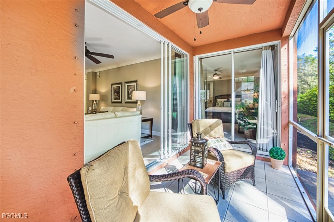 12129 Lucca Street, Unit 102 Fort Myers, FL 33966 - Photo 13 of 40 a view of a dining room with furniture wooden floor and a chandelier