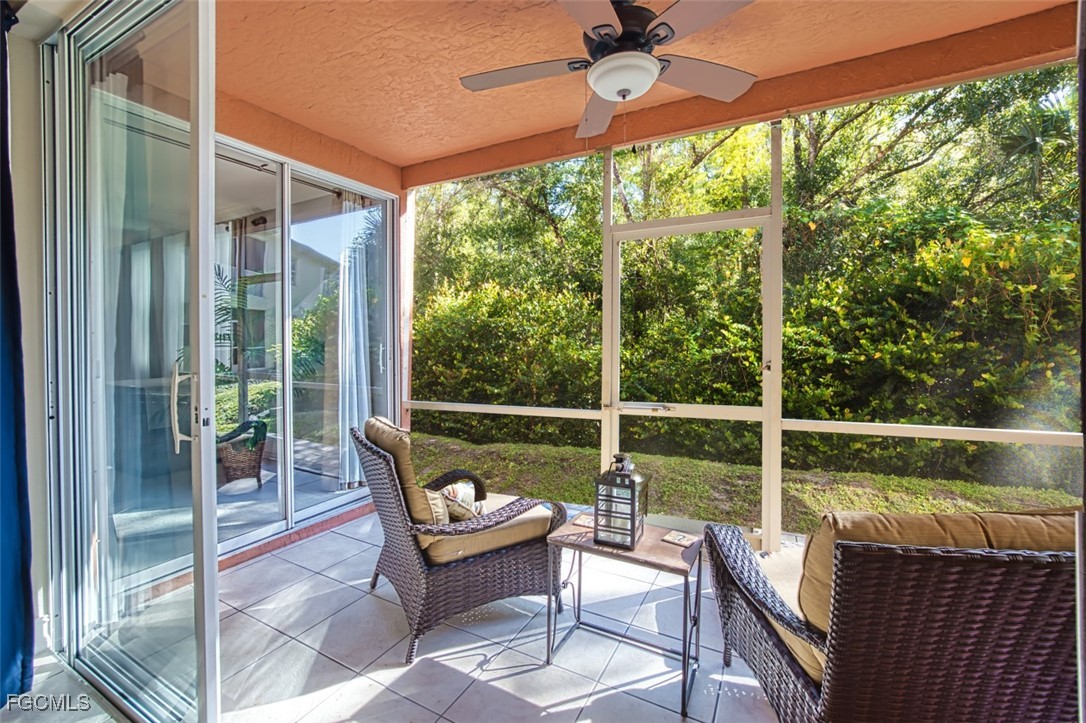 12129 Lucca Street, Unit 102 Fort Myers, FL 33966 - Photo 14 of 40 a view of a chair and tables in the balcony