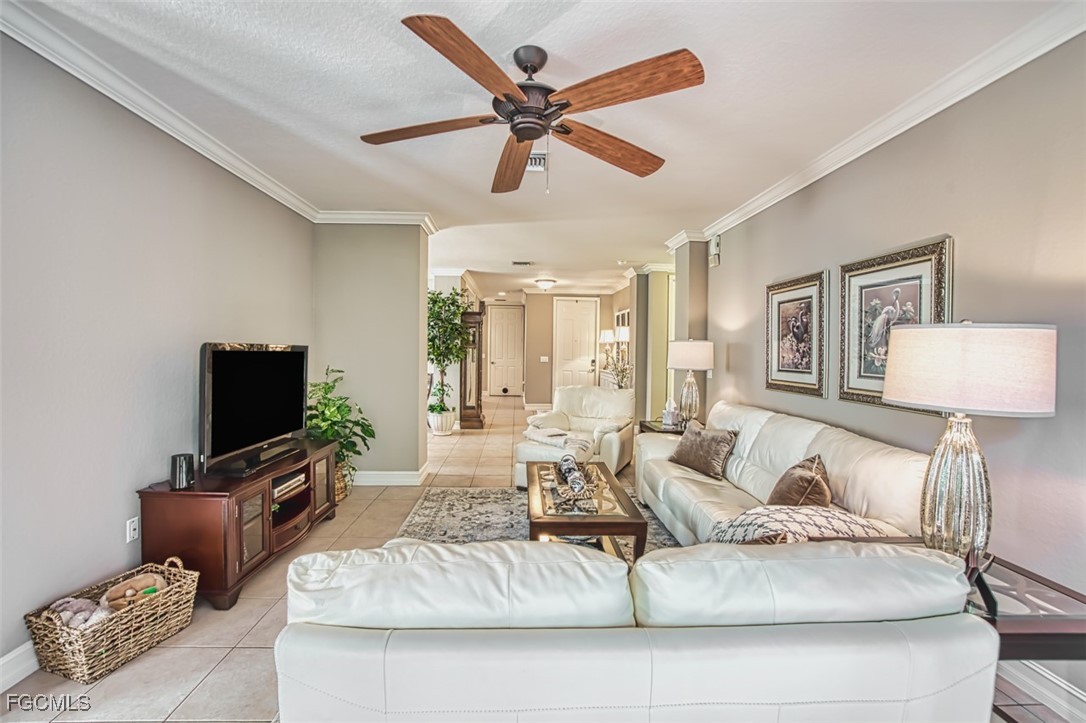 12129 Lucca Street, Unit 102 Fort Myers, FL 33966 - Photo 16 of 40 a living room with furniture and a flat screen tv