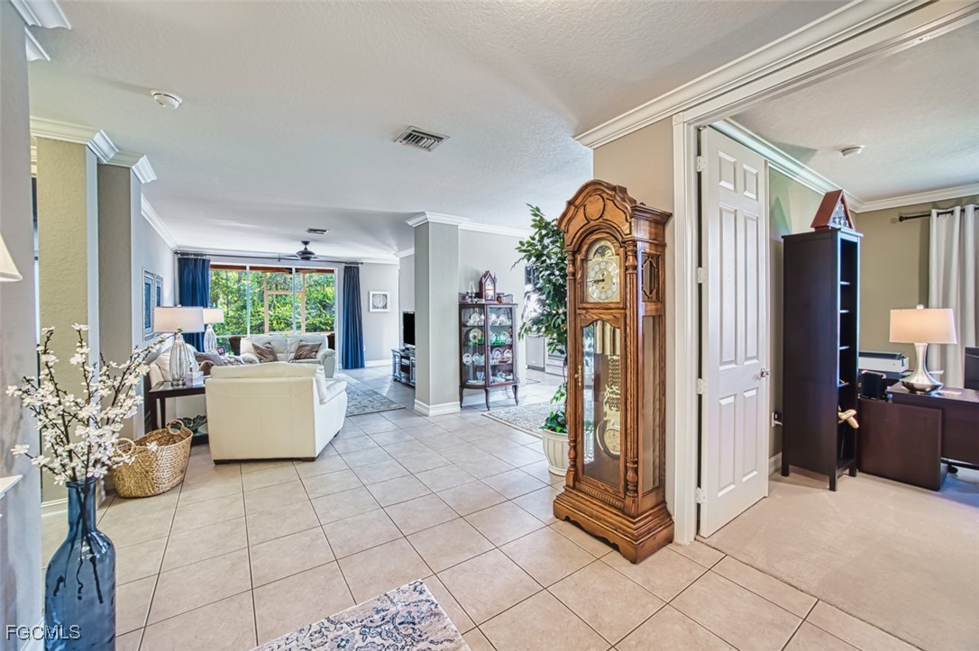 12129 Lucca Street, Unit 102 Fort Myers, FL 33966 - Photo 17 of 40 a view of living room kitchen with furniture and window