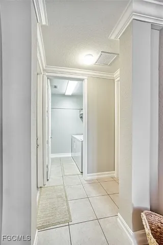 a bathroom with a shower and a glass door