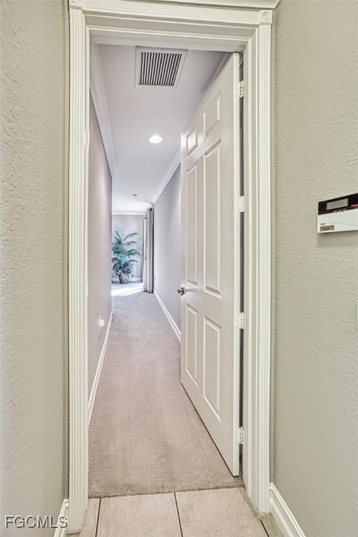 12129 Lucca Street, Unit 102 Fort Myers, FL 33966 - Photo 27 of 40 a view of a hallway with wooden floor and staircase