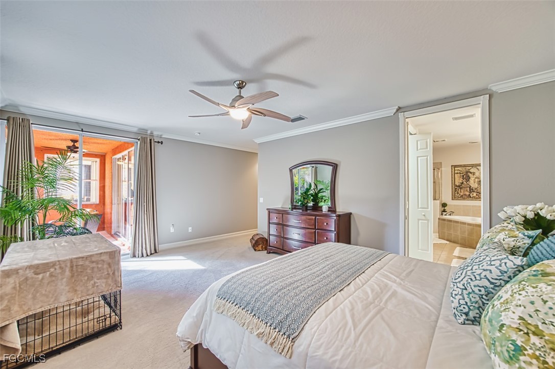 12129 Lucca Street, Unit 102 Fort Myers, FL 33966 - Photo 33 of 40 a bedroom with a bed and a chandelier