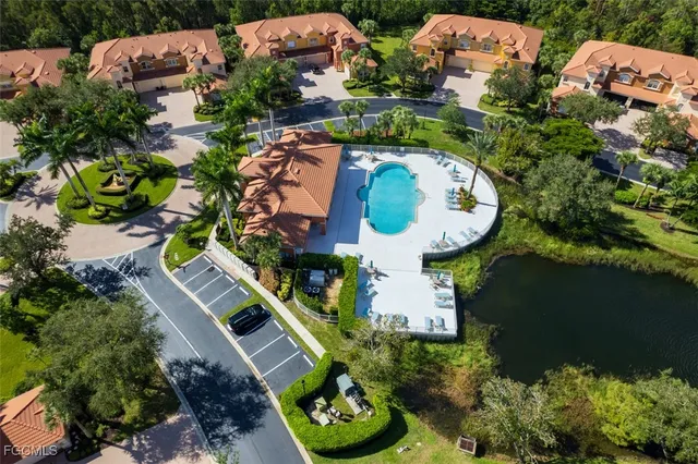 an aerial view of a house with outdoor space swimming pool and outdoor seating