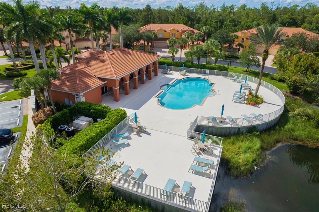 12129 Lucca Street, Unit 102 Fort Myers, FL 33966 - Photo 37 of 40 an aerial view of a house with outdoor space pool patio and lake view