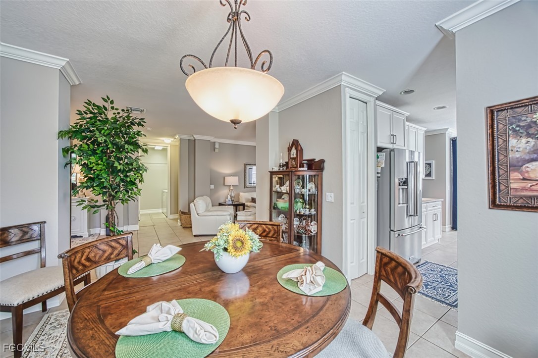 12129 Lucca Street, Unit 102 Fort Myers, FL 33966 - Photo 9 of 40 a view of a dining room with furniture