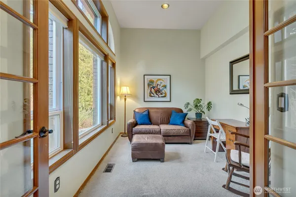a living room with furniture and a large window