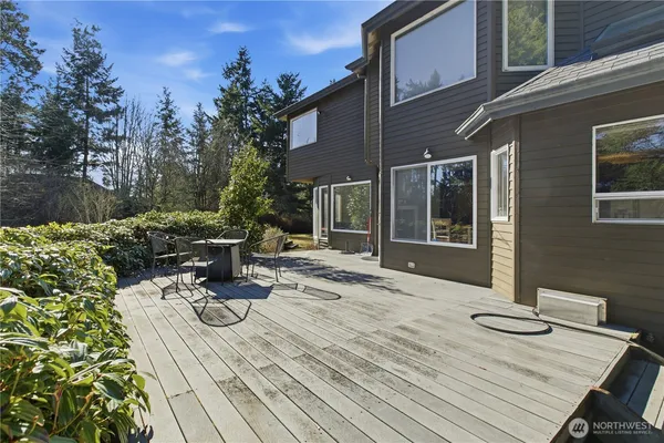 a view of a backyard with sitting area