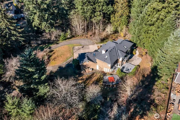 a swimming pool with outdoor seating and yard