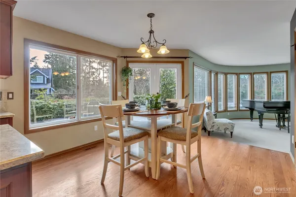 a view of a dining room with furniture window and outside view