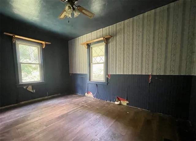 a view of an empty room with a window