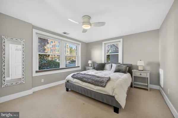 a bedroom with a bed and a shower