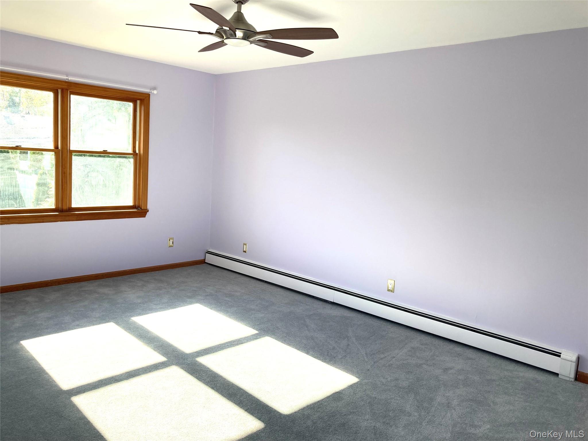 12 Soundview Avenue, Unit UPPR Oyster Bay, NY 11771 - Photo 11 of 20 an empty room with a window