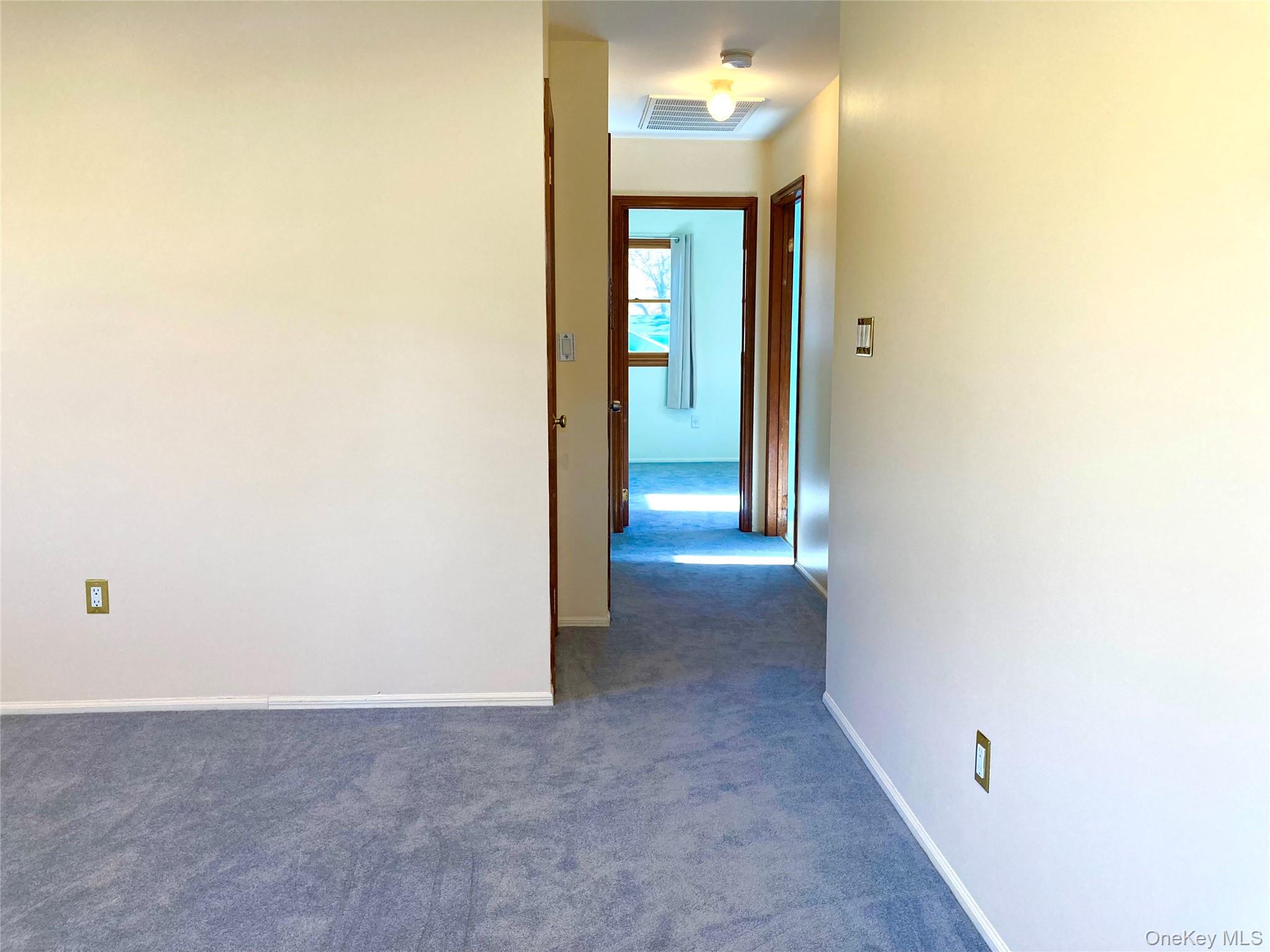 12 Soundview Avenue, Unit UPPR Oyster Bay, NY 11771 - Photo 14 of 20 a view of a hallway with wooden shelves