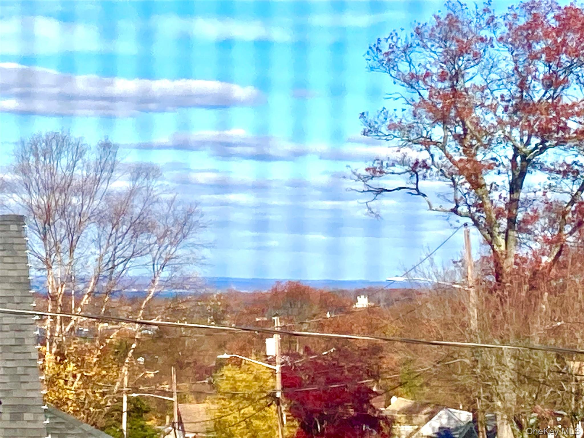 12 Soundview Avenue, Unit UPPR Oyster Bay, NY 11771 - Photo 19 of 20 a view of terrace with tree and wooden fence