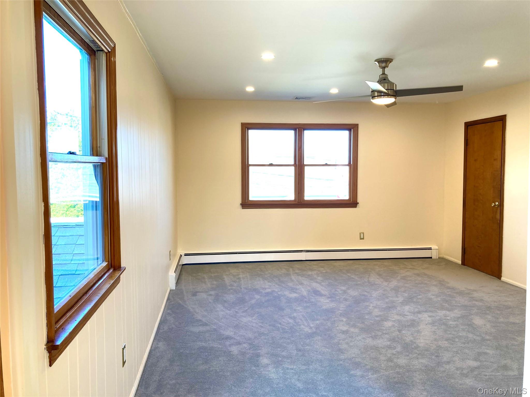 12 Soundview Avenue, Unit UPPR Oyster Bay, NY 11771 - Photo 4 of 20 en view of an empty room with a window