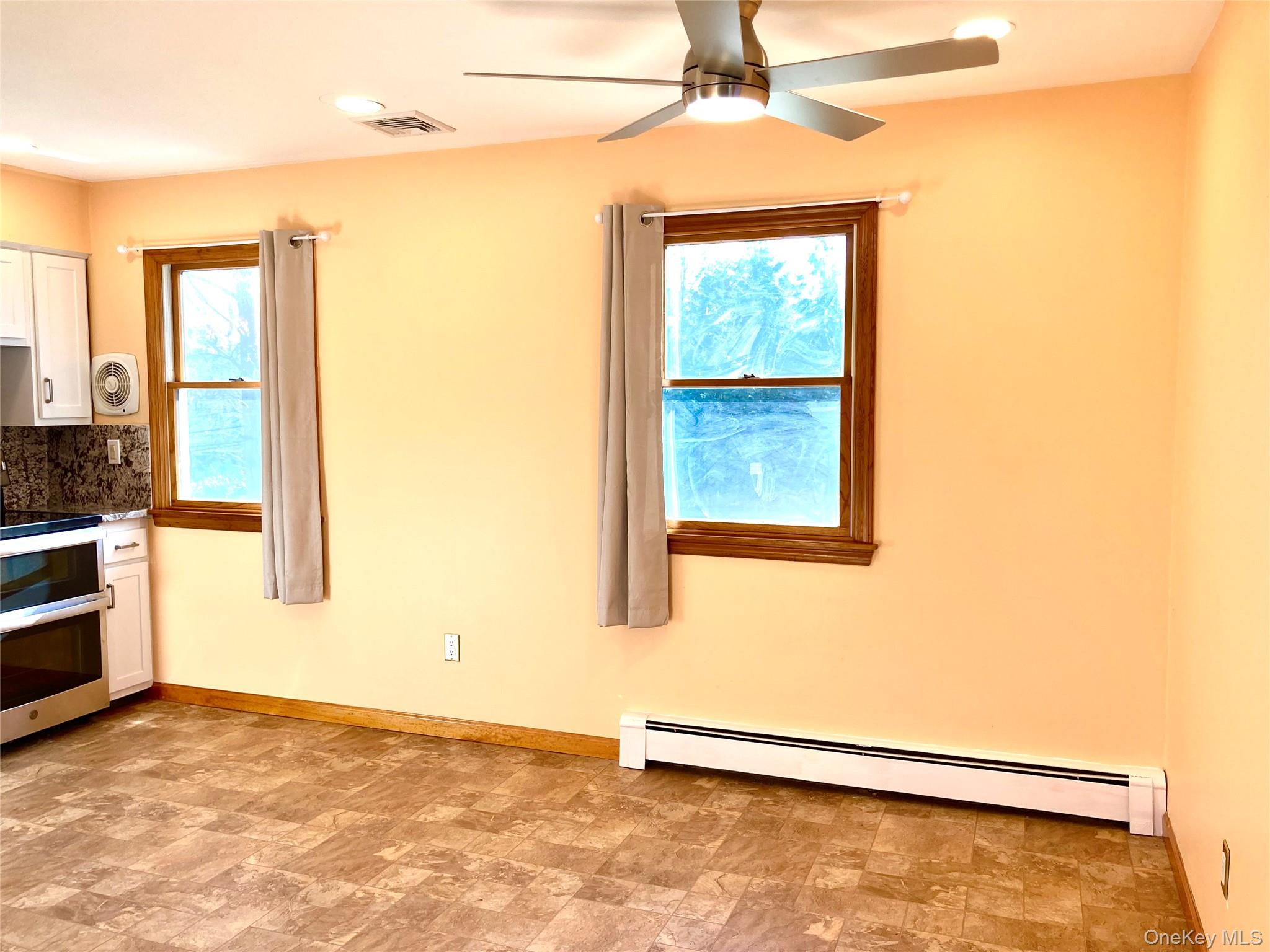 12 Soundview Avenue, Unit UPPR Oyster Bay, NY 11771 - Photo 10 of 20 a view of an empty room with a window