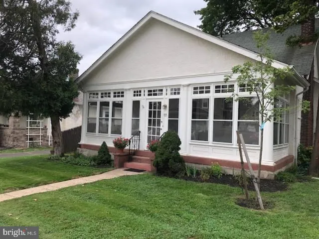 a view of house with yard