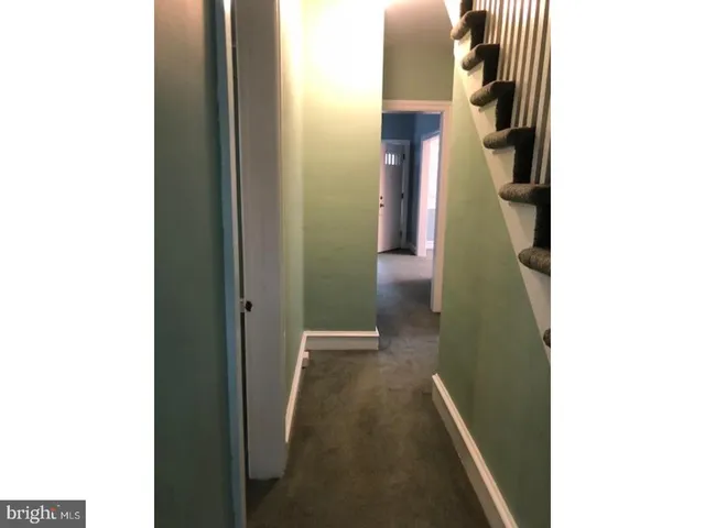 a view of hallway with stairs