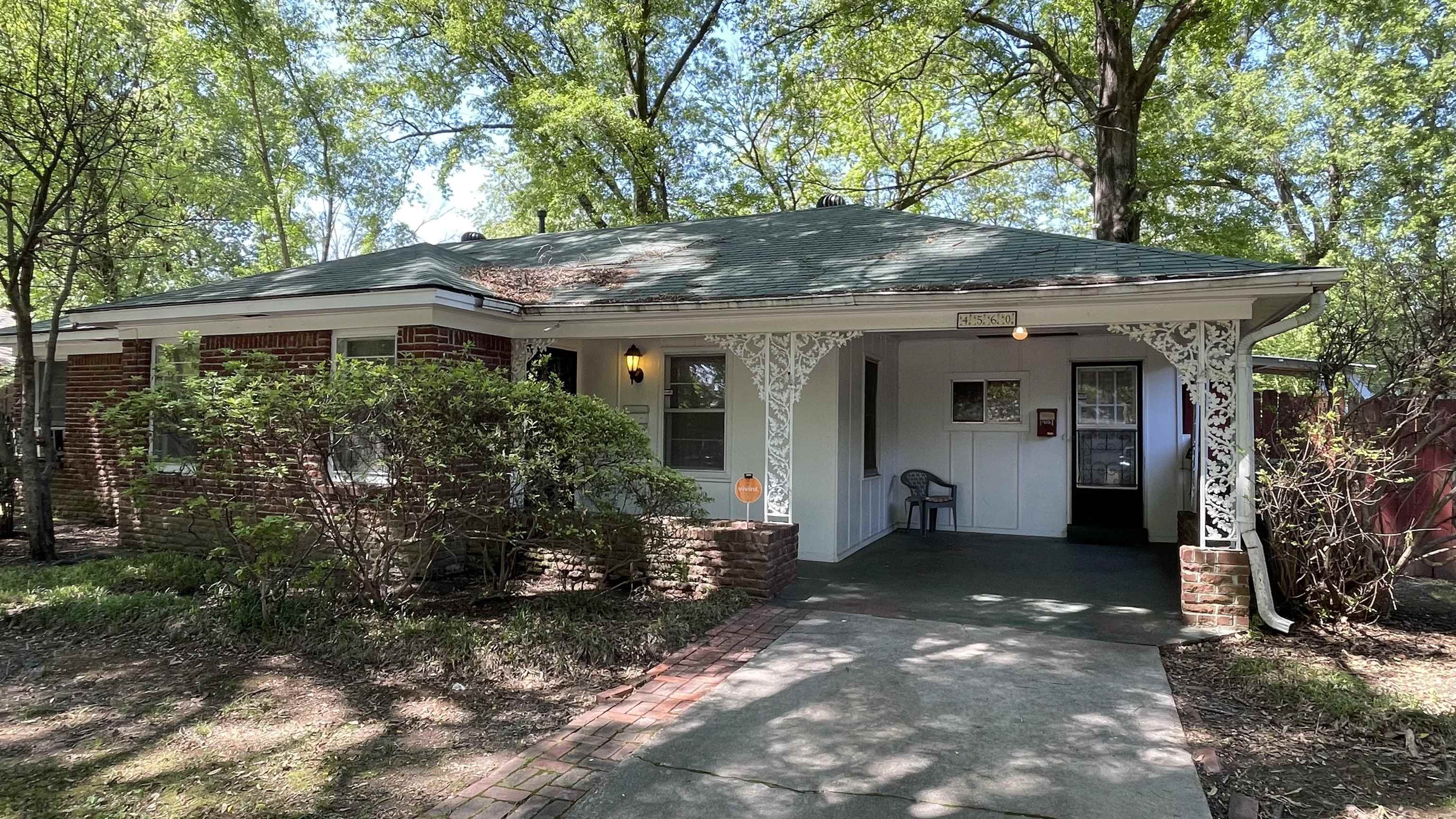 4560 Helene Road Memphis, TN 38117 - Photo 1 of 16 a front view of a house with a garden