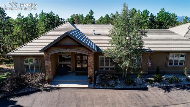 4061 High Forest Road Colorado Springs, CO 80908 - Photo 5 of 40 Grand covered entry.