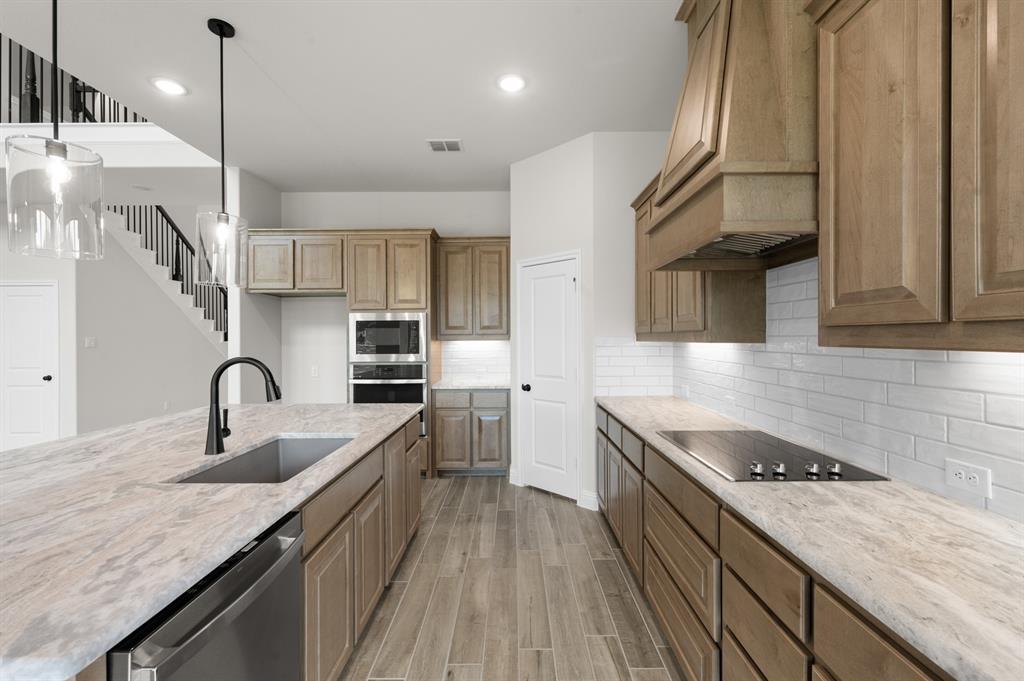 705 Seahawk Street Joshua, TX 76058 - Photo 6 of 28 DFW-Mockingbird Hills-Concept 3473-705 Seahawk Street-Kitchen-Risewell Homes-3