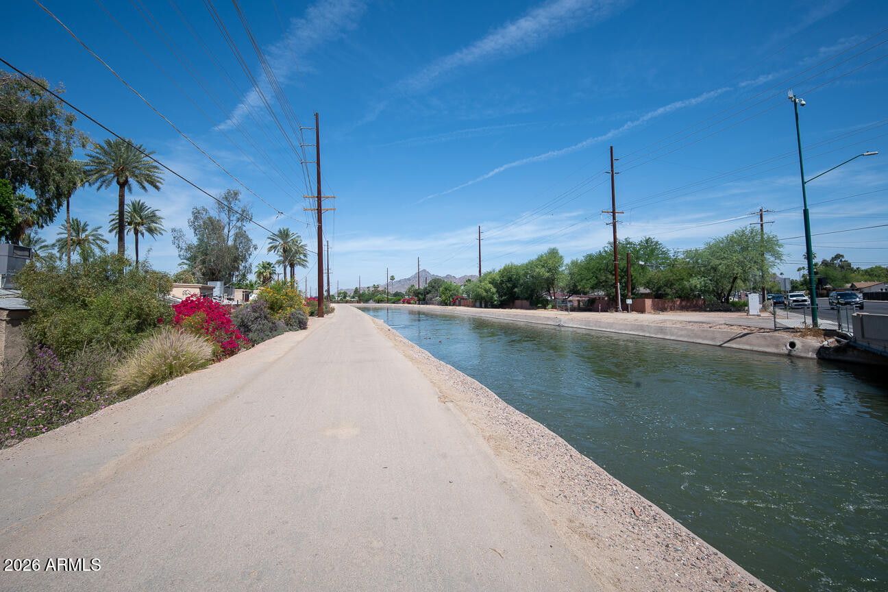 4540 North 44th Street, Unit 50 Phoenix, AZ 85018 - Photo 30 of 31 a view of a lake with a house in background