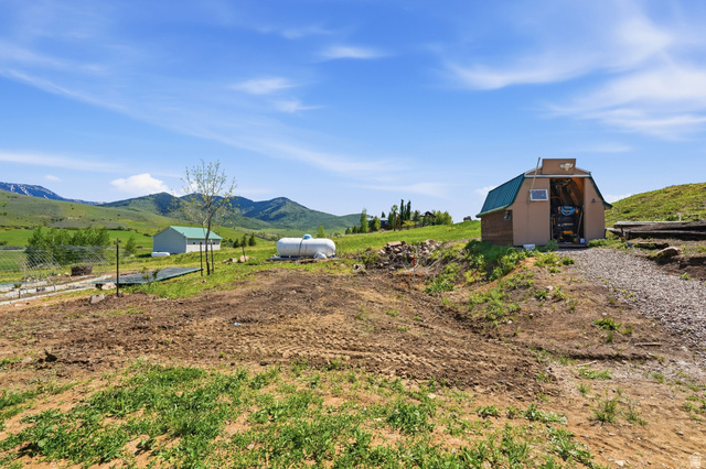 8066 North Valley View Heights Preston, ID 83263 - Photo 29 of 34 Gable-roofed shed with green metal roofing