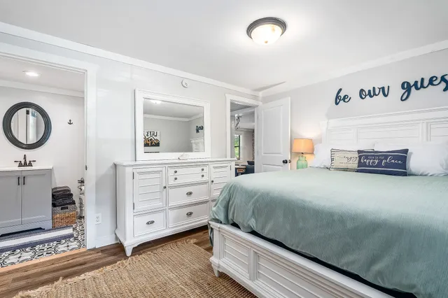 a bedroom with a bed and a dresser
