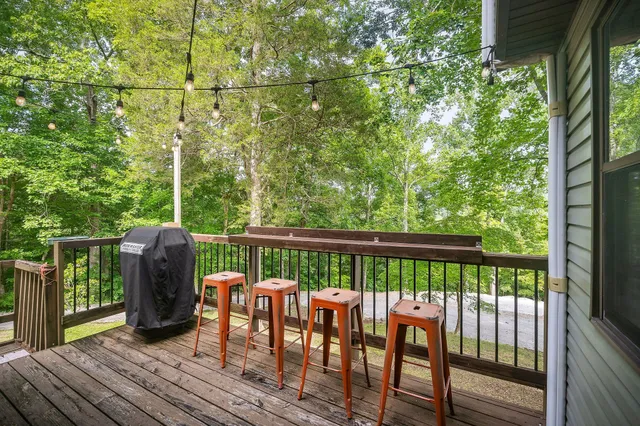 a backyard of a house with yard and outdoor seating