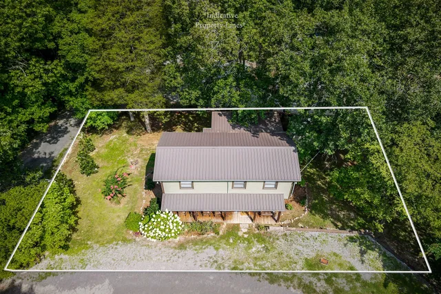 aerial view of a house with a garden