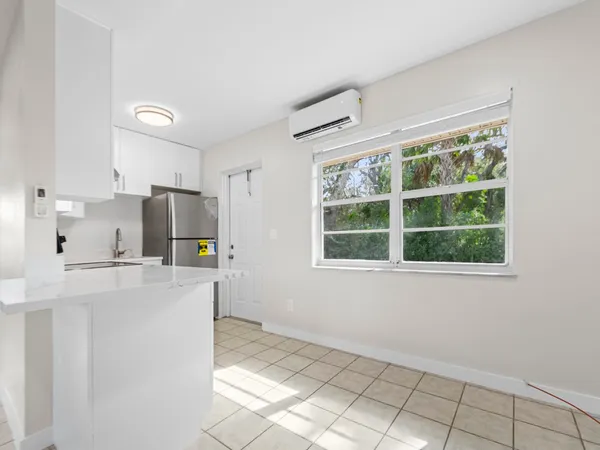 a kitchen with stainless steel appliances a refrigerator a stove a sink a microwave and cabinets