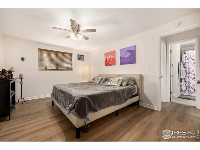 a spacious bedroom with a bed and a table