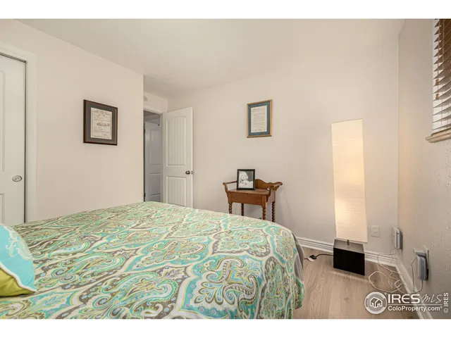 a bedroom with a bed and a table