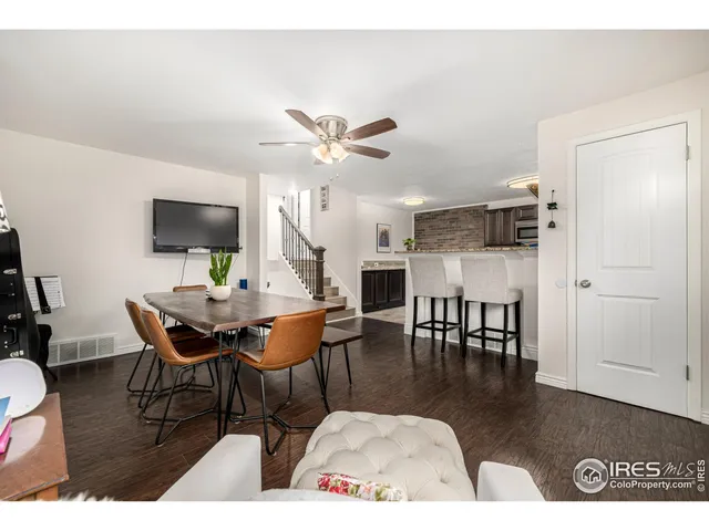 a living room with furniture a table and a flat screen tv