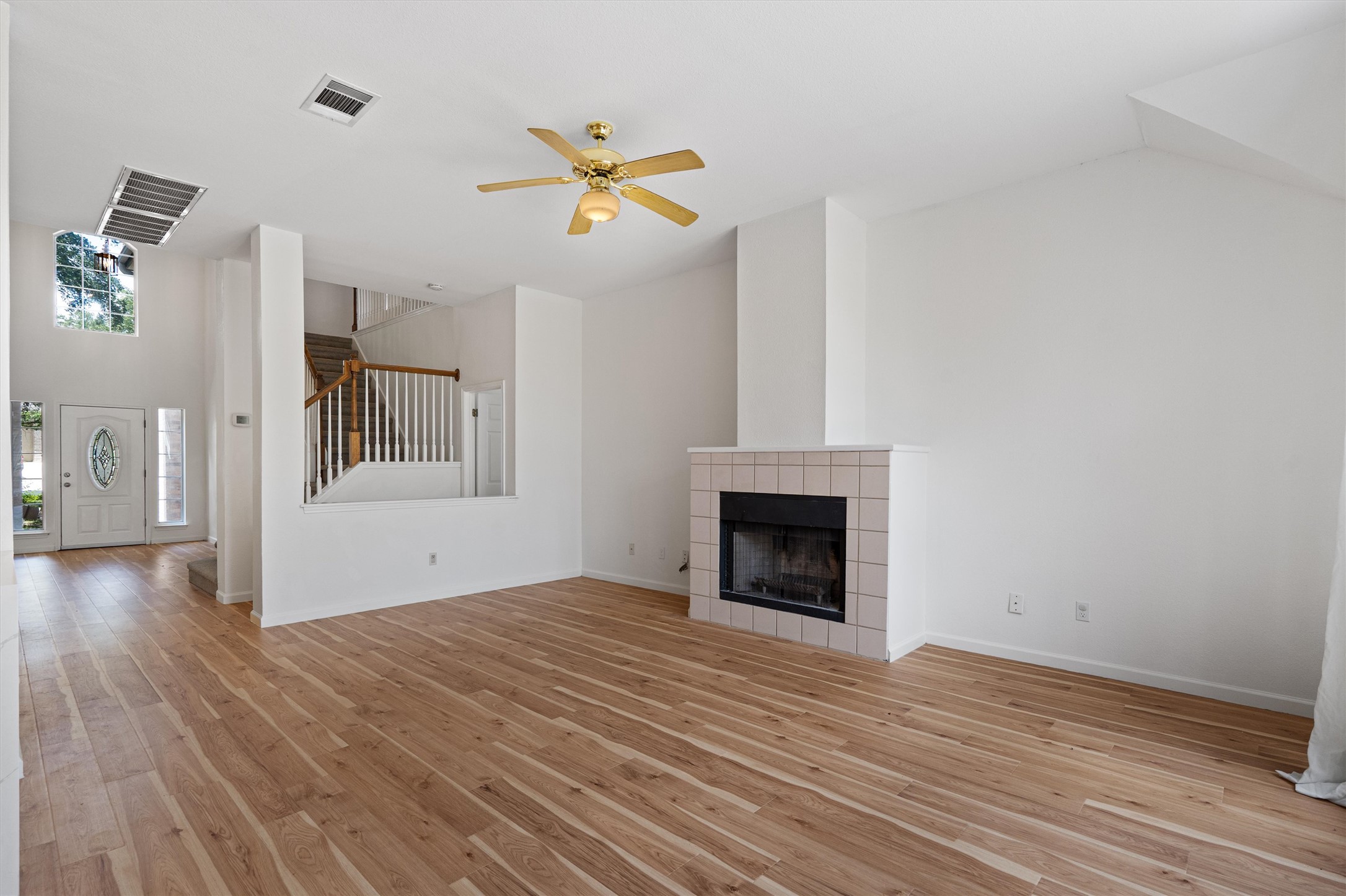 100 Parque Circle Georgetown, TX 78626 - Photo 10 of 39 a view of empty room with wooden floor and fireplace